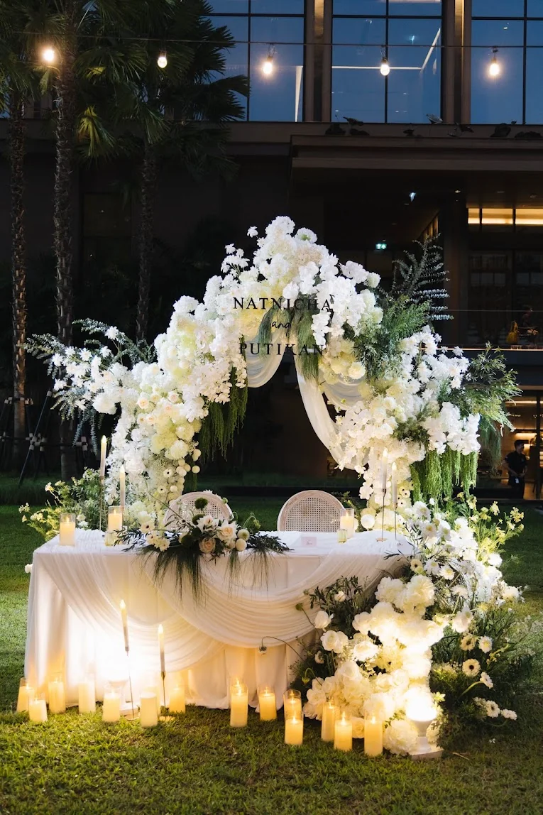 White floral ceremony canopy on the lawn at the Annie & Louis celebration in Bangkok
