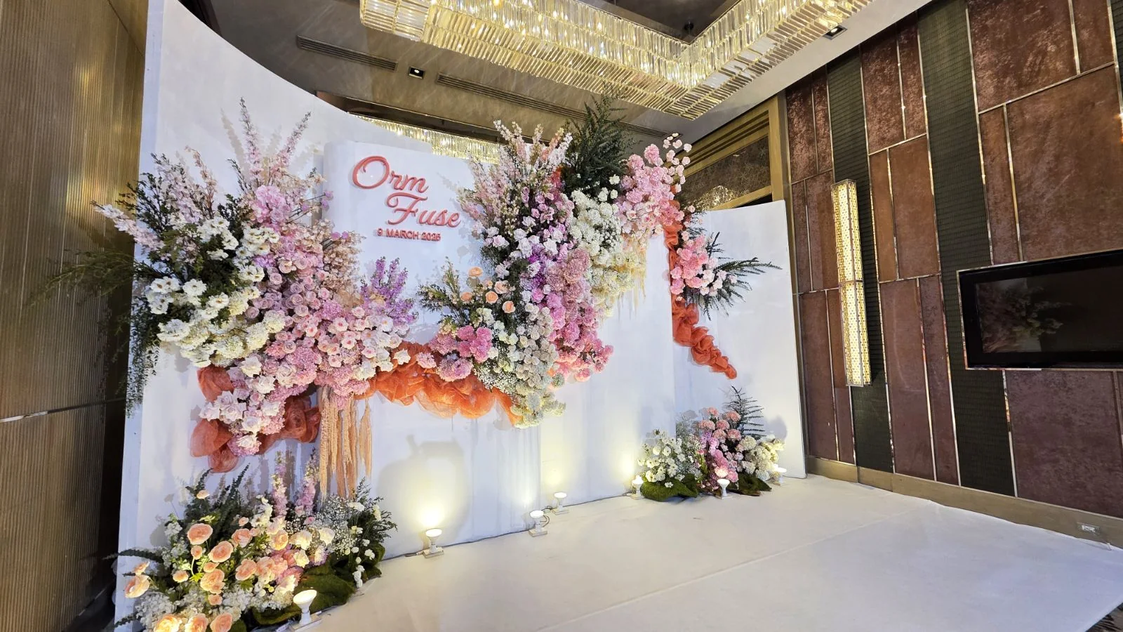 Pastel floral welcome backdrop at the Orm & Fuse celebration in Bangkok