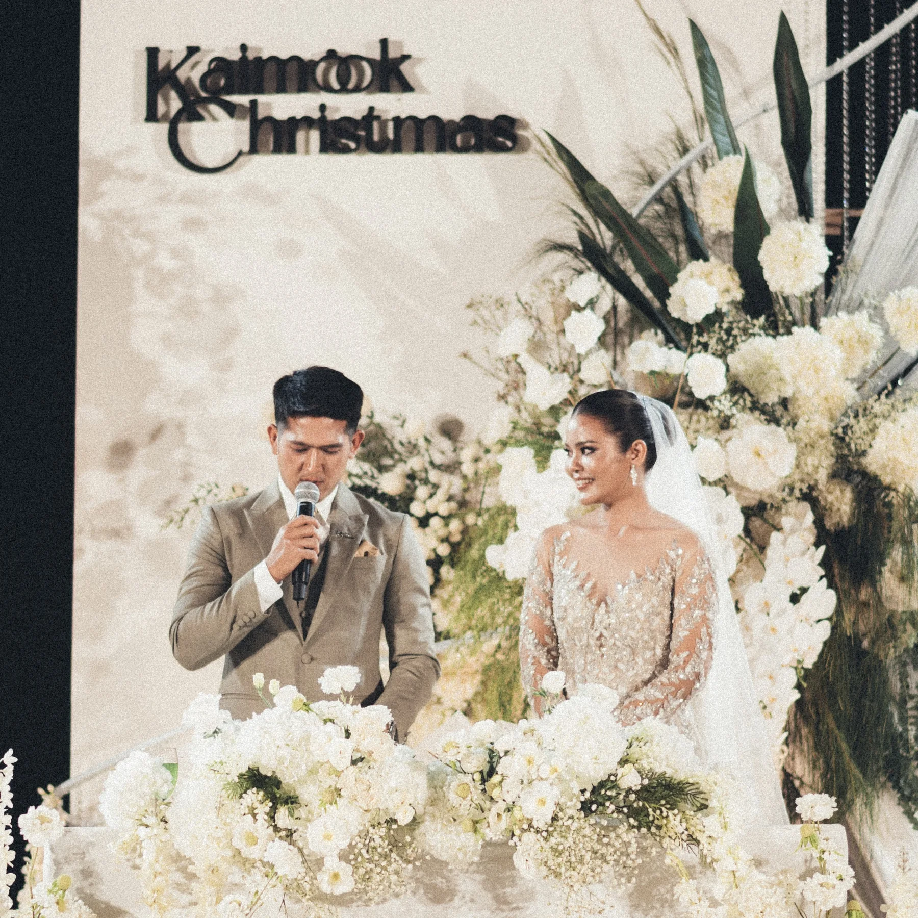 Wedding ceremony on the white floral stage at the Mook — Christmas Wedding celebration in Lopburi
