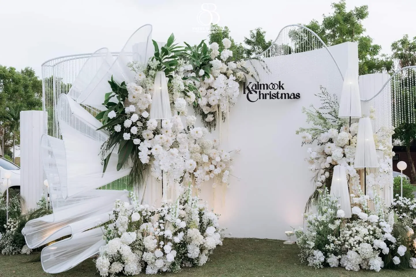White floral welcome installation at the Mook — Christmas Wedding celebration in Lopburi