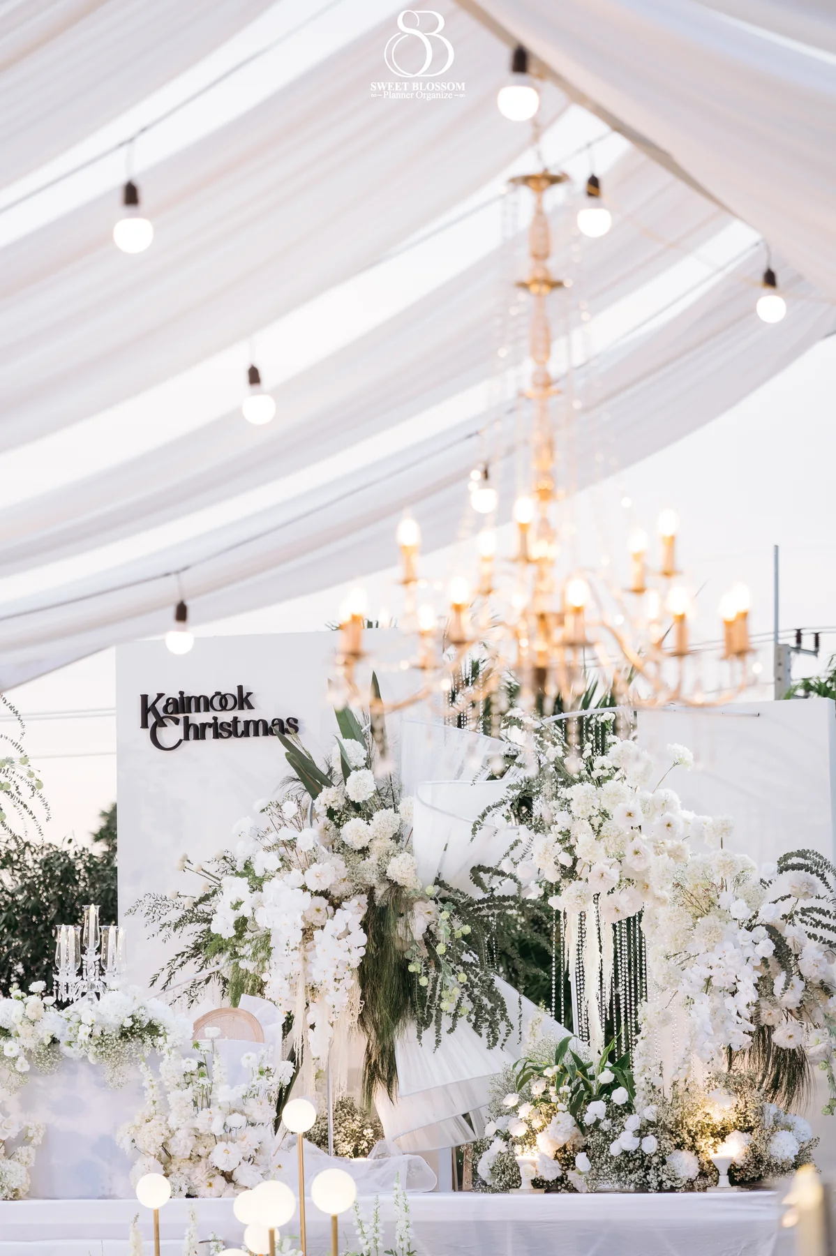 White and gold reception decor beneath the marquee at the Mook — Christmas Wedding celebration in Lopburi
