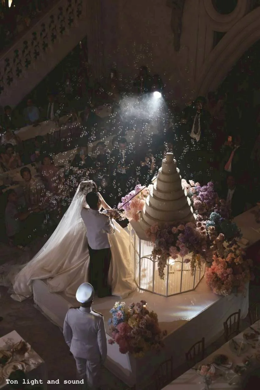 Bride on the chapel staircase at the Nan & Big celebration in Bangkok