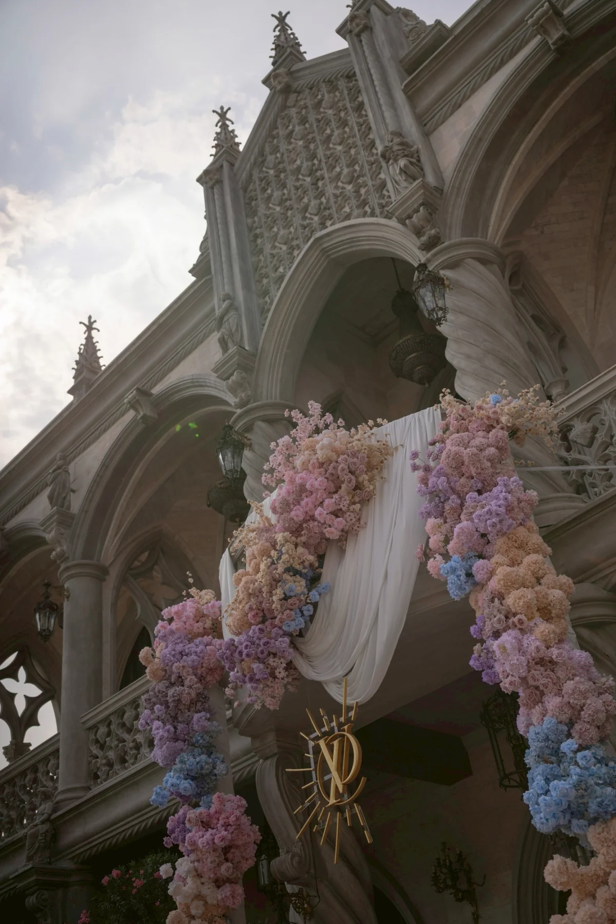 Pastel floral installation on the chapel exterior at the Nan & Big celebration in Bangkok