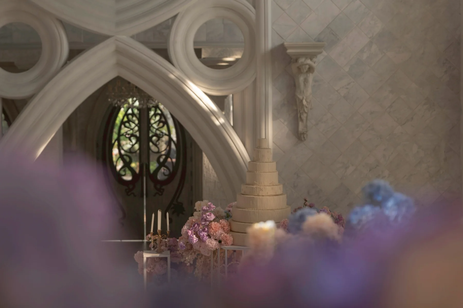 Chapel arch detail with pastel flowers at the Nan & Big celebration in Bangkok