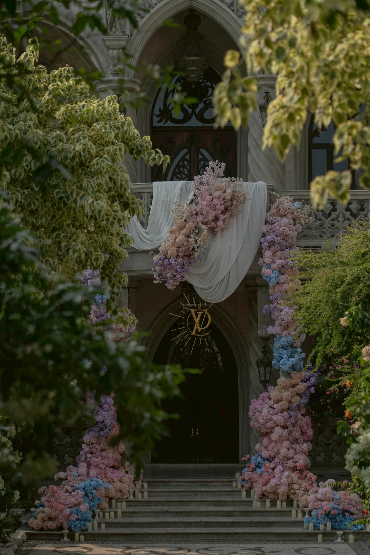 Pastel flower installation at the chapel entrance at the Nan & Big celebration in Bangkok