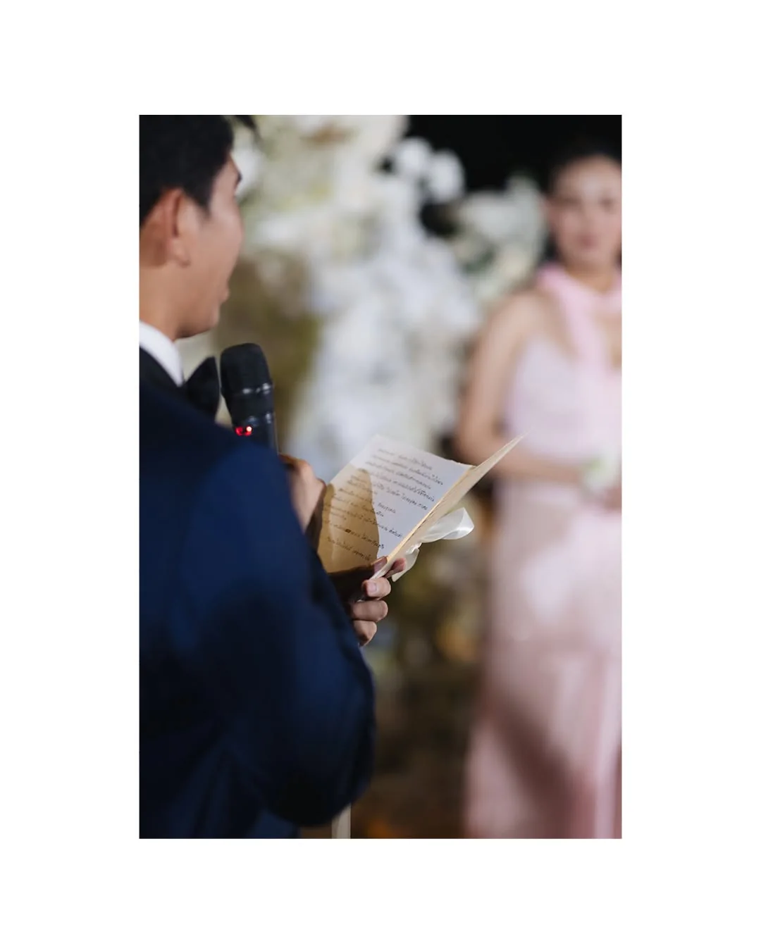 Bride smiling during the ceremony at the Natt & Yang celebration in Bangkok
