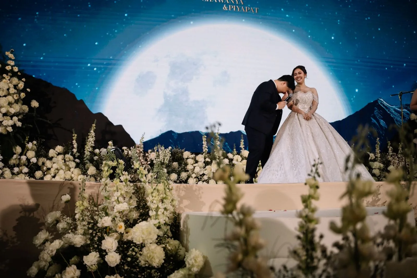 Couple portrait before the moonlit wedding stage at the Tangthai & Heng celebration in Pathum Thani