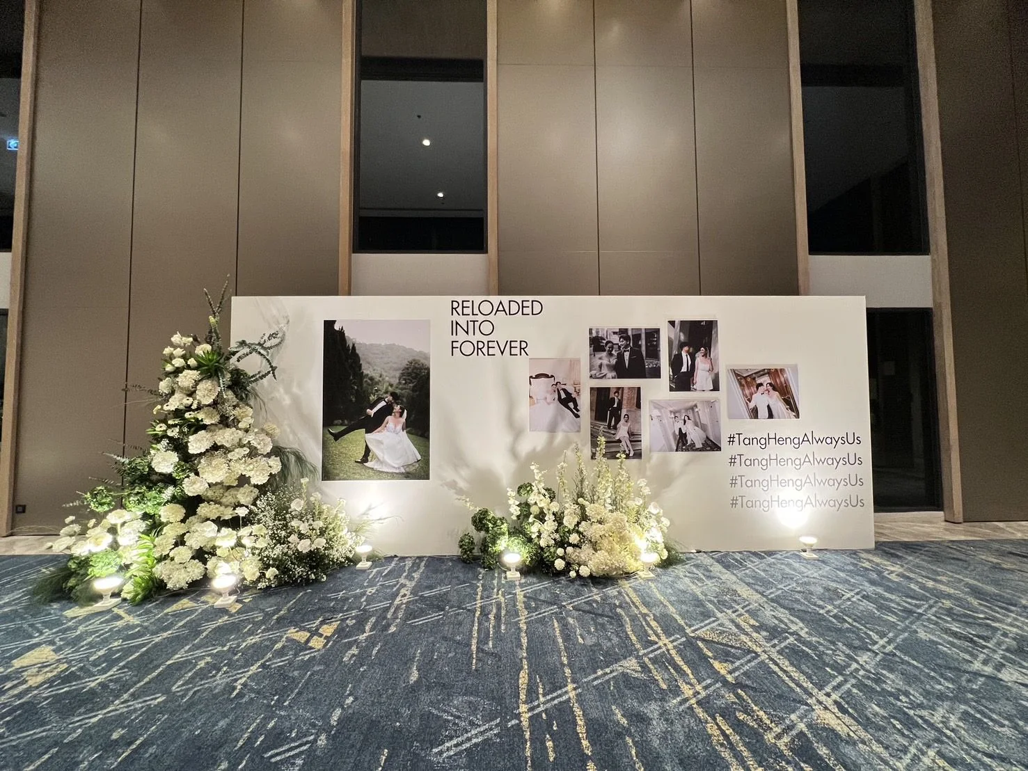 Wedding welcome gallery with flowers and photographs at the Tangthai & Heng celebration in Pathum Thani